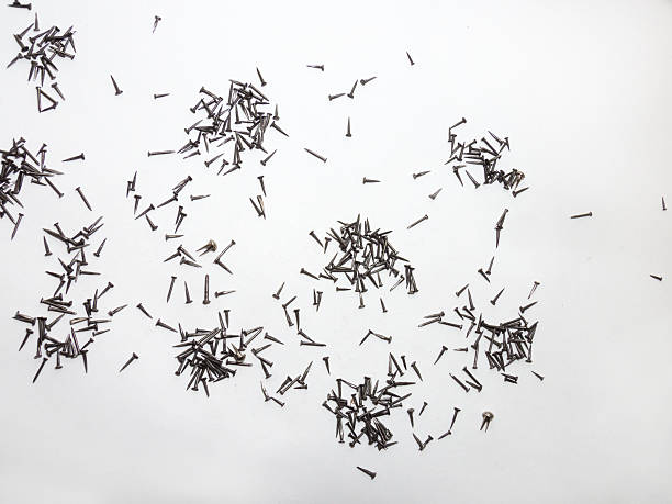 istock Handfuls of Shoe nails scattered on paper 522782238