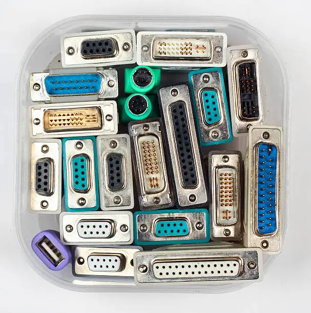 Photo of Computer connectors and adapters in plastic jar