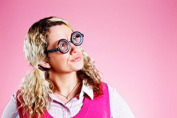 istock Cute, geeky blonde thinks things over 522782689
