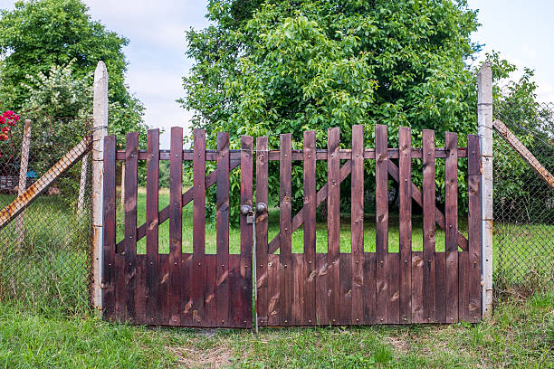 istock Solid wooden door entering the garden 522784012
