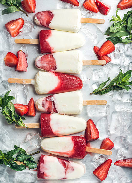 istock Strawberry yogurt ice cream popsicles with mint 522784586