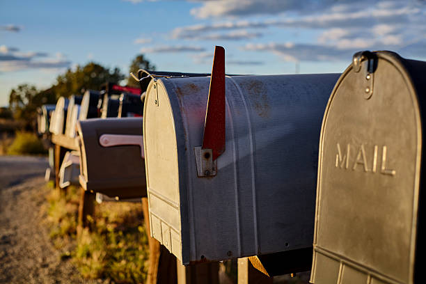 istock Rural Mailboxes with US Flag in Distance 522784844