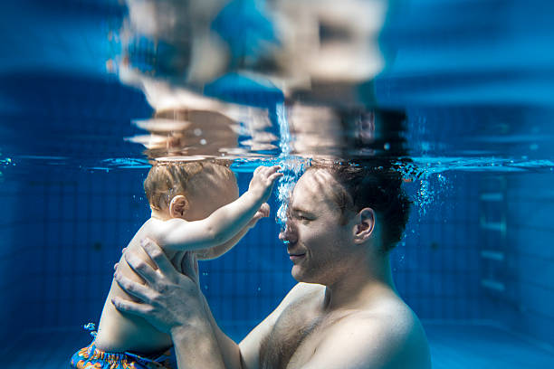 little diver - baby swim under water bildbanksfoton och bilder