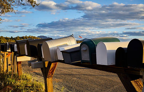 istock Rural Mailboxes with US Flag in Distance 522785186