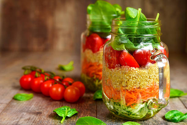 istock Salad with quinoa and vegetables in a mason jar. 522786962