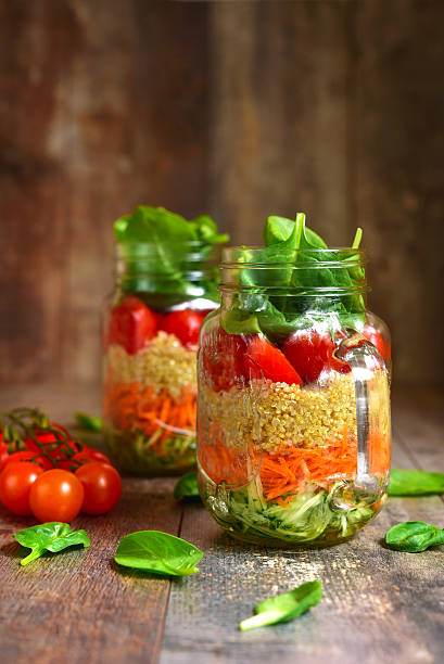 istock Salad with quinoa and vegetables in a mason jar. 522787198