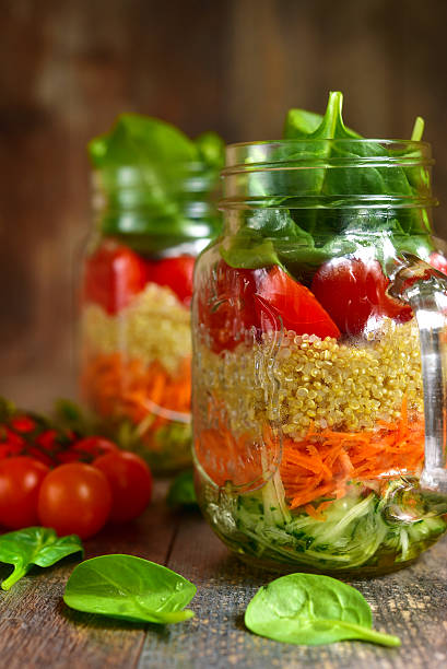 istock Salad with quinoa and vegetables in a mason jar. 522787464