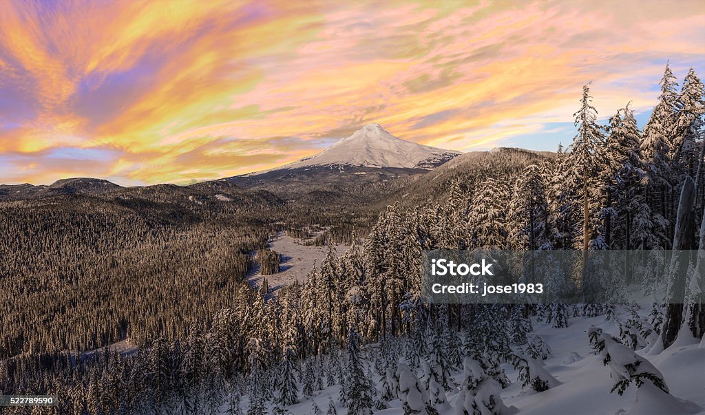 Stormy Winter Vista of Mount Hood in Oregon, USA. Majestic View of Mt. Hood on a stormy evening during the Winter months. Winter Stock Photo