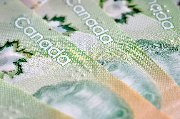 Canadain Money A close up image of Canadian $20 Dollar bills canadian currency photos stock pictures, royalty-free photos & images