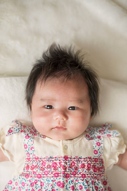istock Baby lying on the white rug 522790328