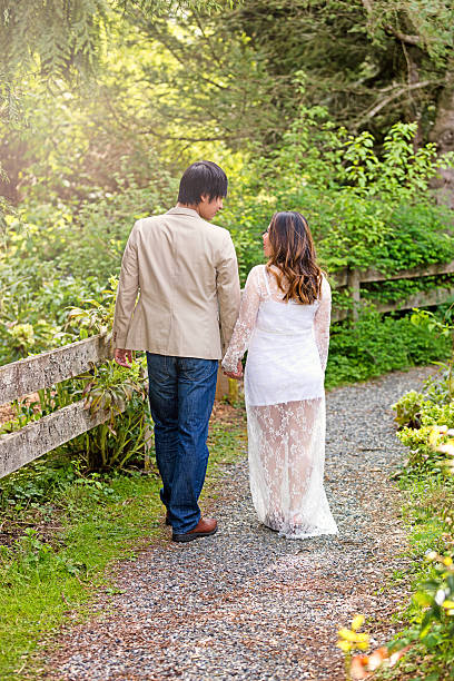 istock Expecting mom and dad on a walk through the woods 522791086