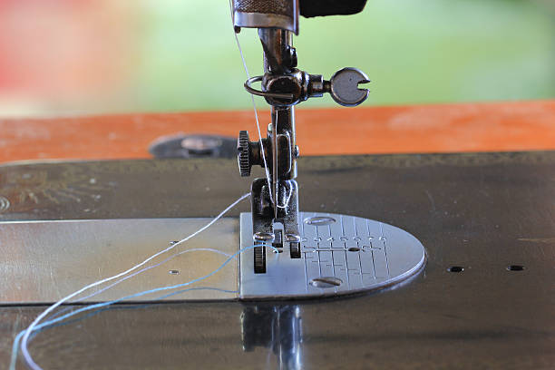 istock sewing machine and item of clothing, old sewing machine. 522791128