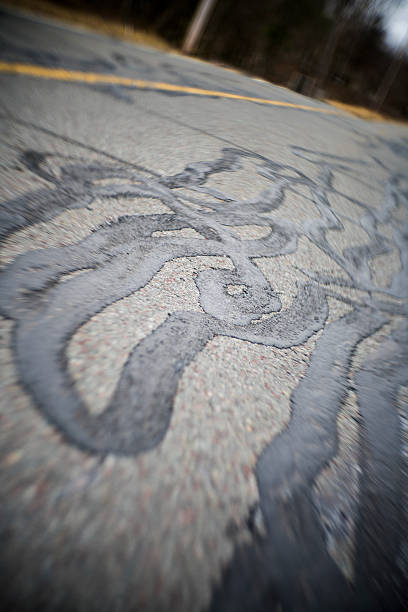 istock Abstract background: the asphalt road's surface with repare's lines 522791720