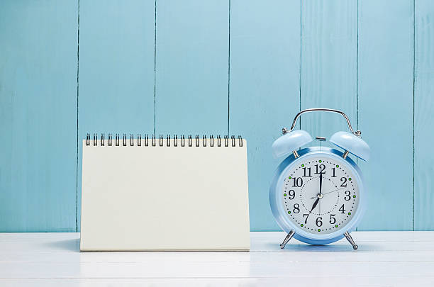 istock Blank desk calender with vintage Alarm clock 522793410
