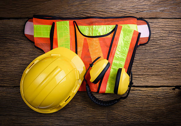 istock Standard construction safety equipment on wooden table 522795328