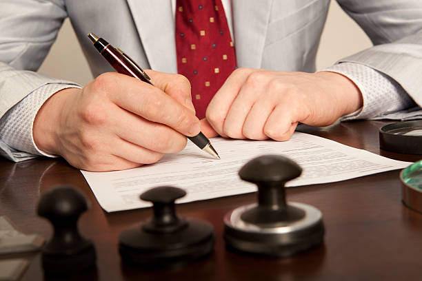 istock Notary signs the documents from our office 522797236