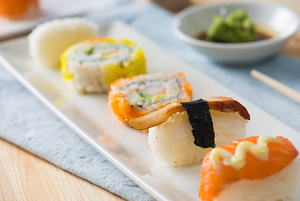 istock Salmon and caviar rolls served on a plate 522797678