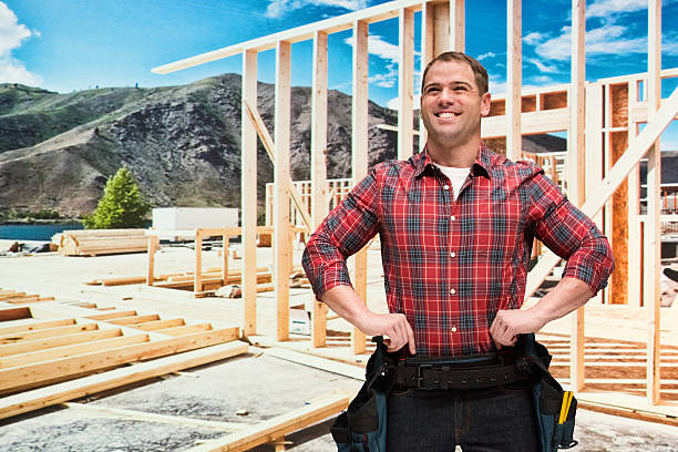istock Smiling building contractor standing outdoor 522797984