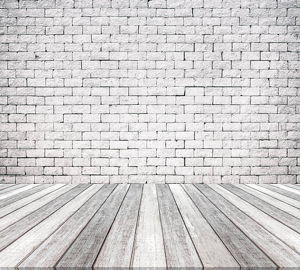 istock Room interior with white brick wall and wooden floor texture 522798206