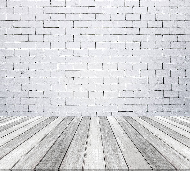 istock Room interior with white brick wall and wooden floor texture 522798348