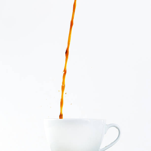 istock Pouring coffee in a cup on white background. Breakfast. 522799145