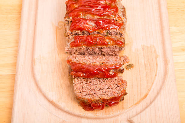 istock Fresh Baked Meatloaf Sliced on Wood Cutting Board 522800061