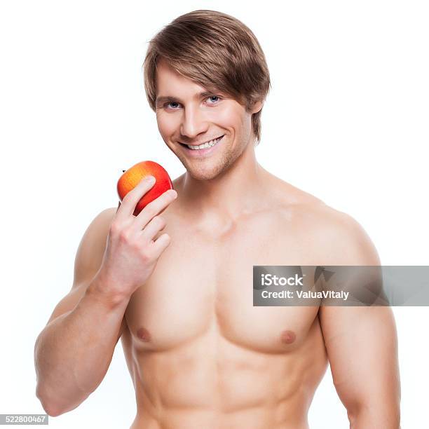 Young Smiling Bodybuilder Holding Apple Stock Photo - Download Image Now - Adult, Adults Only, Anaerobic Exercise