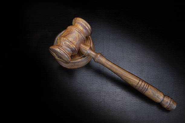istock Judges Or Auctioneer Gavel On Black Wood Grunge Background 522801320