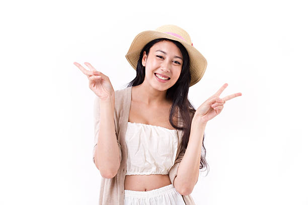 istock smiling lady with asian happy victory hand gesture 522801816