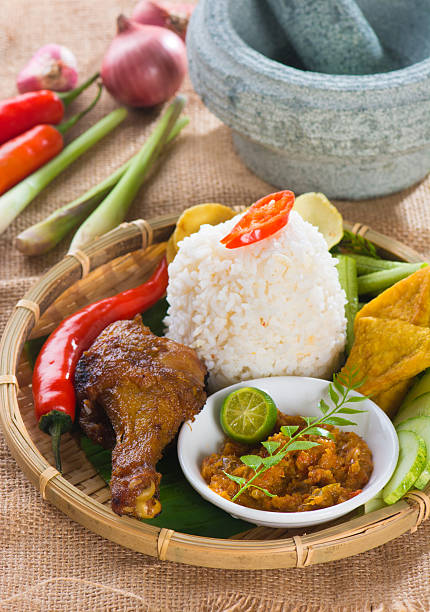 istock indonesian fried chicken rice on traditional background 522802536