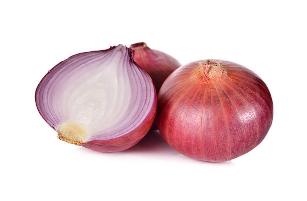 istock whloe and half cut red onion, shallots on white background 522802554
