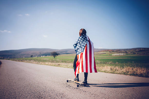 istock Woman holding an American flag 522803296