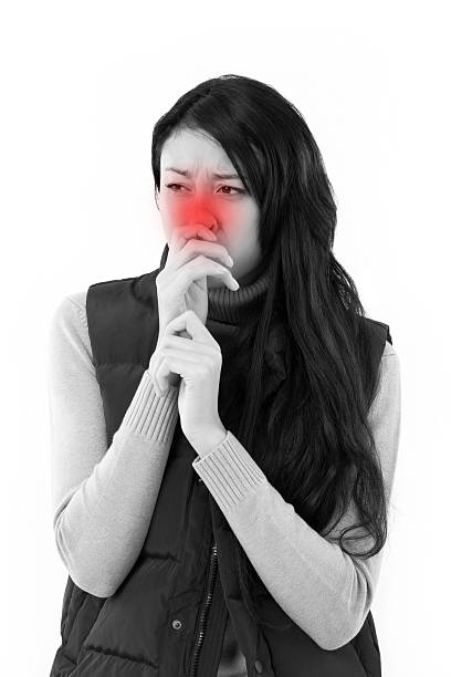 istock sick woman suffering from runny nose 522803706
