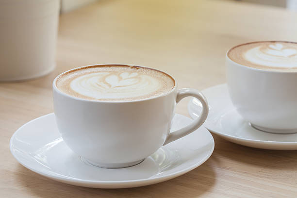 istock Latte Coffee art on the wooden table 522806250