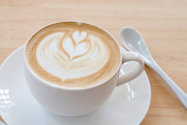 istock Latte Coffee art on the wooden table 522806574