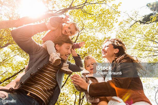 Family Having Fun In Nature Stock Photo - Download Image Now - Autumn, Family, Adult