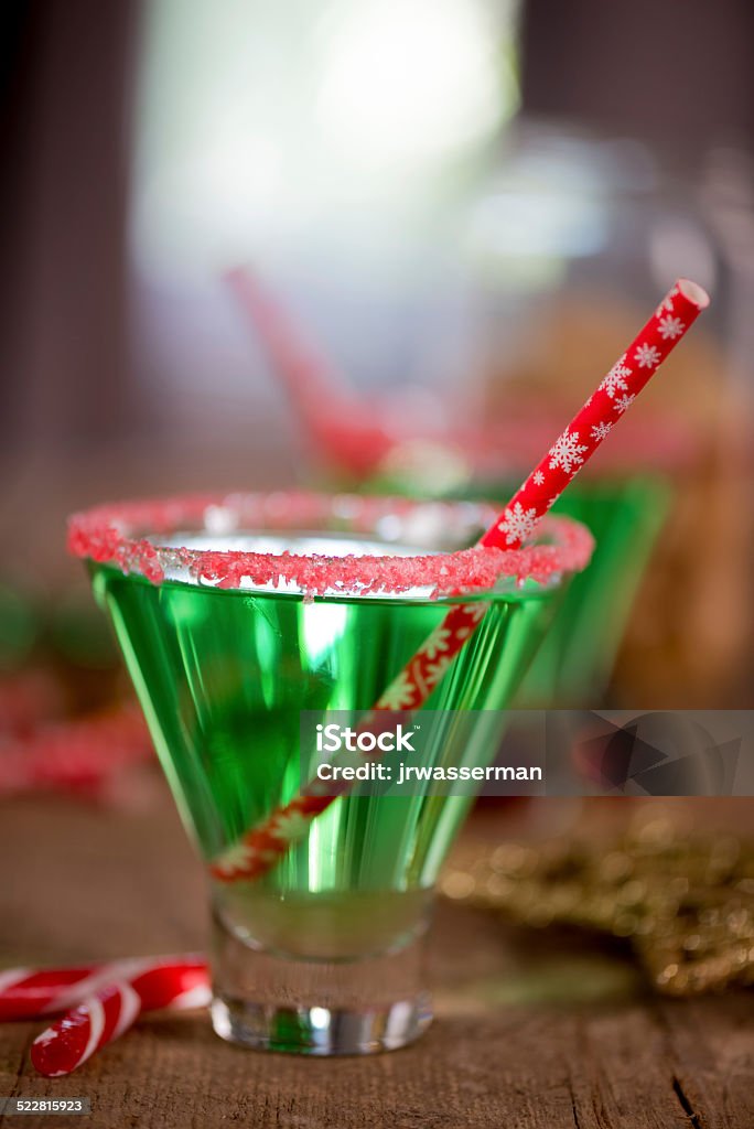 Christmas Emerald Green Cocktail Christmas emerald green cocktail, glass rimmed with crushed candy cane. Great drink for entertaining. Alcohol - Drink Stock Photo