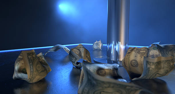 Stripper Tips On Stage An isolated stripper pole on a stage lit by a single spotlight surrounded by crumpled up one dollar bill tips on a stripclub background strip club stock pictures, royalty-free photos & images