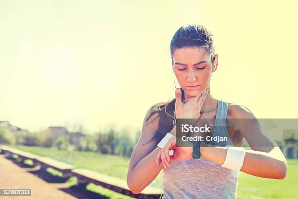 Young Woman Measuring Heart Rate After Running Stock Photo - Download Image Now - Activity, Adult, Adults Only