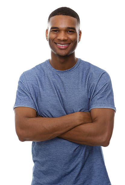 istock Handsome african american man smiling with arms crossed 522818151