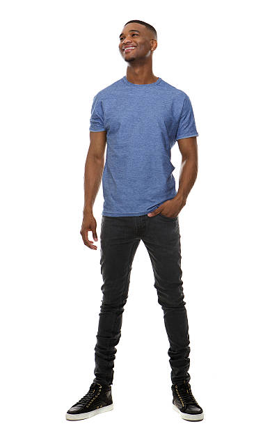 istock Happy young man standing on isolated white background 522818455