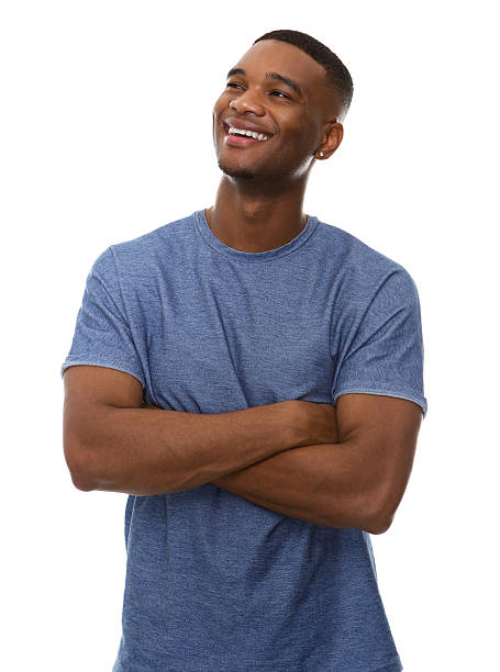 istock Attractive young black man smiling with arms crossed 522818467