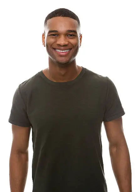 Photo of Smiling young man with green t-shirt