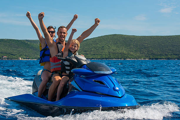 istock Family Riding A Jet Boat 522819333