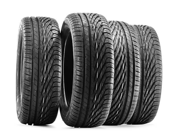istock Four new black tires isolated on white 522820357