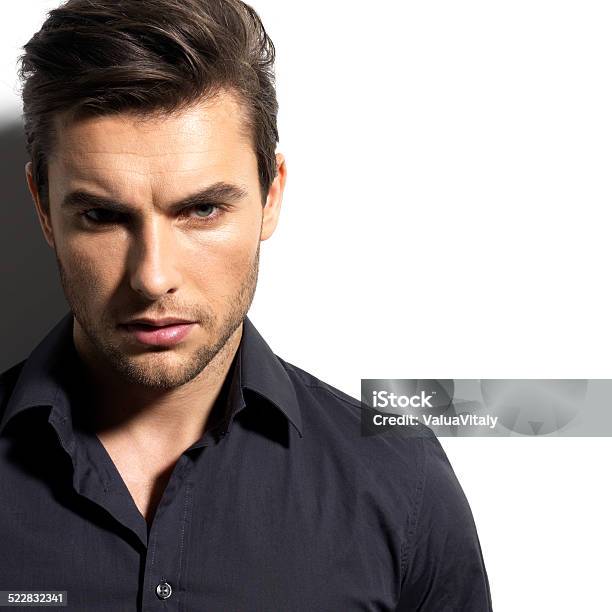 Fashion Portrait Of Young Man In Black Shirt Stock Photo - Download Image Now - Men, Hairstyle, Only Men