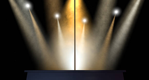 Stripper Pole Spotlit An isolated stripper pole on a stage lit by an array of spotlights on a dark background strip club stock pictures, royalty-free photos & images