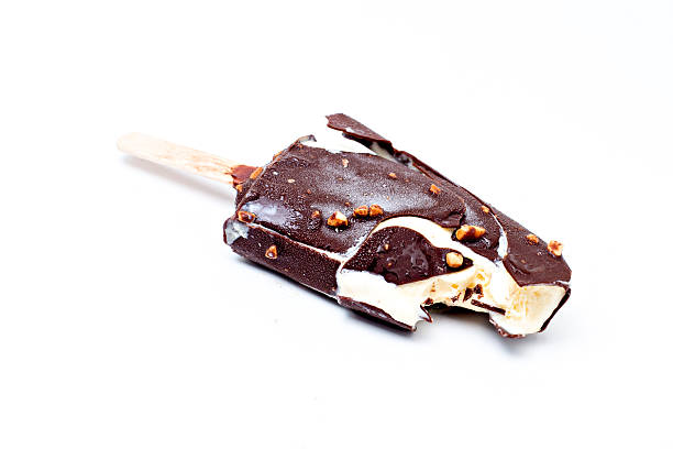 istock Holding ice Cream chocolate popsicle, isolated on white 522835435