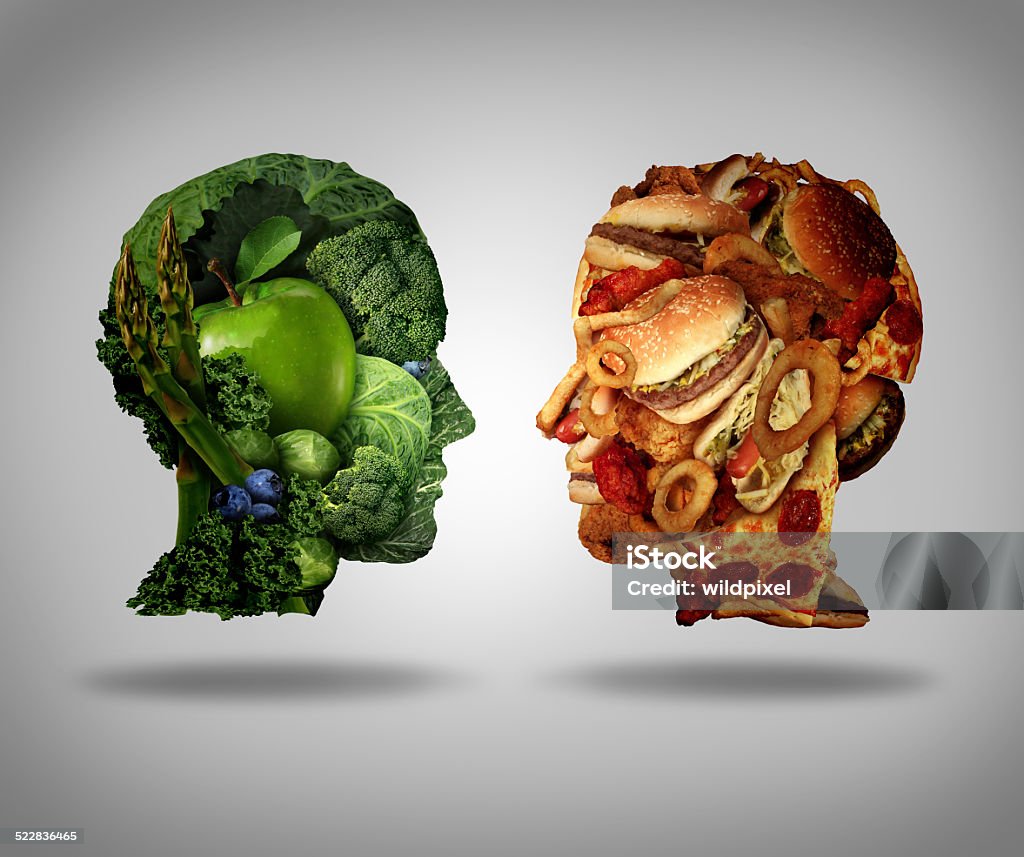 Lifestyle Choice Lifestyle choice and dilemma concept as a two human faces one made of fresh green vegetables and fruit and the other head shaped with greasy fast food as hamburgers and fried foods as a symbol of nutrition facts and healthy living issues. Choice Stock Photo