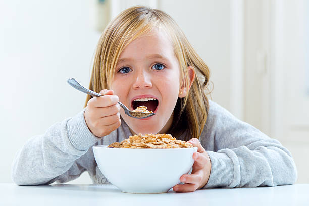 istock Beautiful child having breakfast at home. 522836767